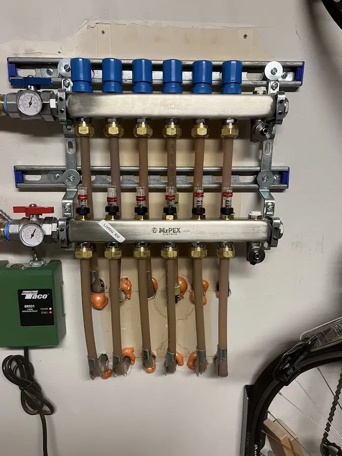 Plumber performing Water Heater Repair at a residential property in Sparta